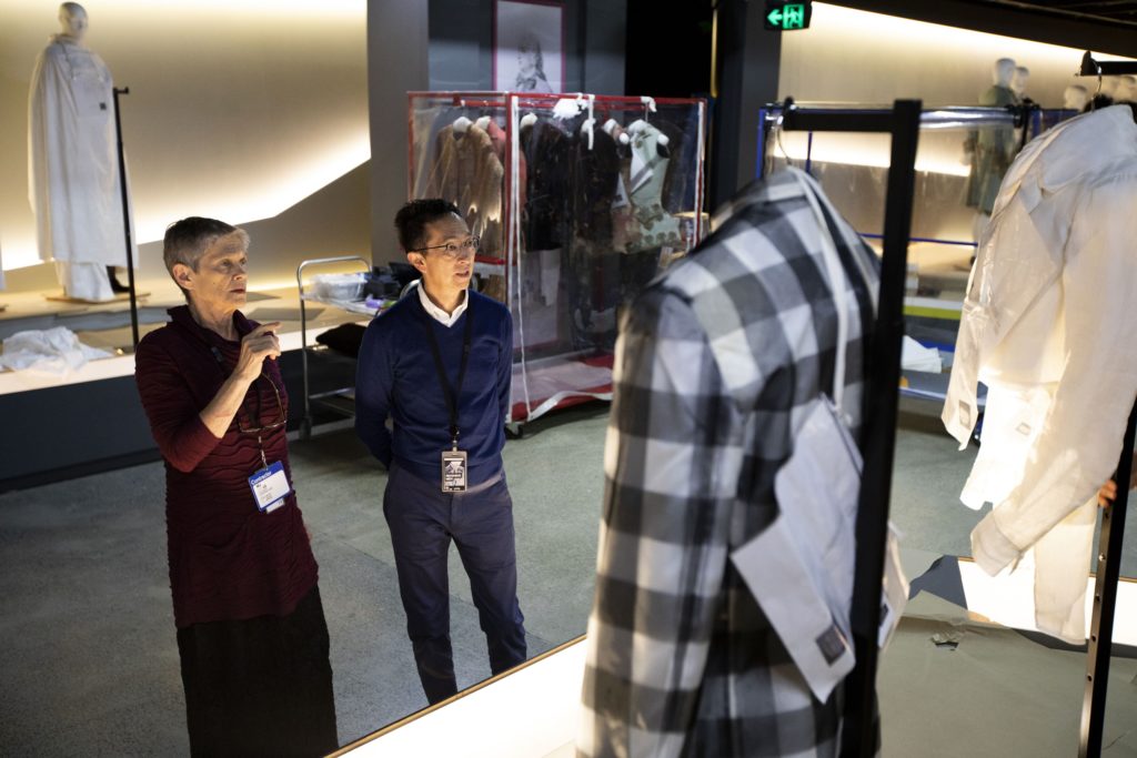 Kaye Spilker, Curator, Costume and Textiles (LACMA) and Roger Leong, Senior Curator (MAAS), deciding on the final positions